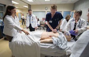 nursing students in simulation with a high-fidelity manikin